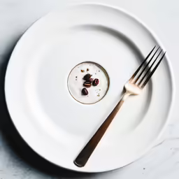 a white plate with some nuts on top of it