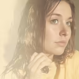 the girl with long hair has a smirk on her face
