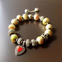 the charm bracelet has heart charms on it,a bracelet made of glass beads with charms and beads