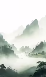 a foggy river flowing down through some mountains