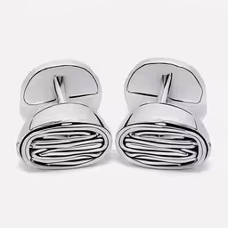 pair of chrome cufflinks on white background