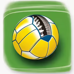 an orange and yellow soccer ball sitting on top of a green field