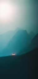 a car is parked in a field surrounded by mountains