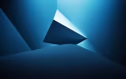 an inverted photograph of a blue light in a black background