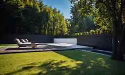 a wooden patio with chairs overlooking a lush green yard