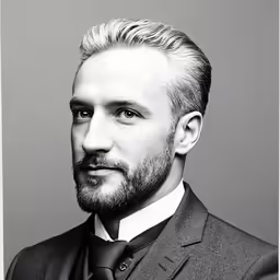 a black and white photo of a man in a suit and tie