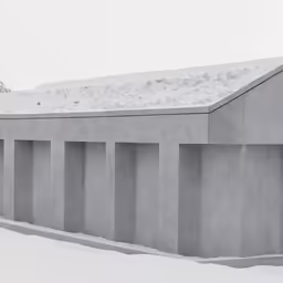 two large concrete walls in the snow with a person looking up