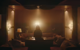 a lady looking at the light in her living room