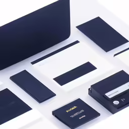 an assortment of business cards and stationery are sitting next to each other