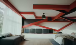 modern looking red and white bedroom with wood floors