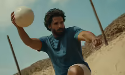 a man is holding a frisbee in his hands