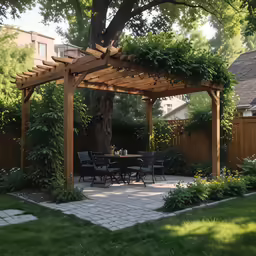 a covered patio and table under a tree