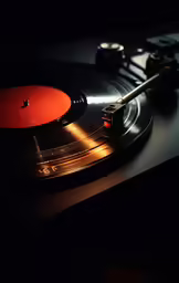 a record player is playing music on top of the turntable