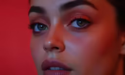 a woman with large blue eyes and brown hair