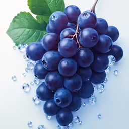 a bunch of grapes that are next to a leaf