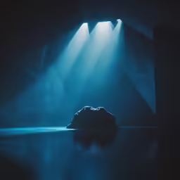 the light streams down into the blue water below