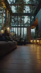 some people sitting around on couches in the middle of the room
