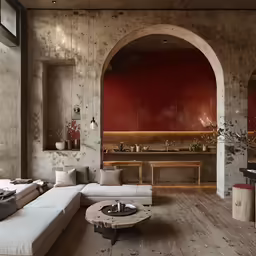 a room with stone walls and white couches
