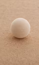 a stone with no surface is laying on the ground
