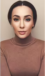 a model wearing brown sweaters with eye makeup