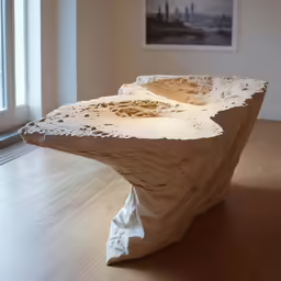 clay artwork sitting in front of a window