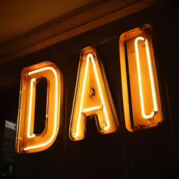 lighted sign saying dad on a black wall