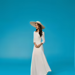 a woman wearing a hat and a white dress