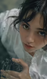 a woman in white shirt next to water