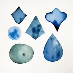 four abstract pictures each with some blue circles on them