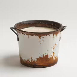 an old tin can filled with water and some oil