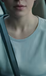 the lady is wearing an unbuttoned shirt