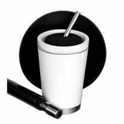 a coffee cup on a table with a pen