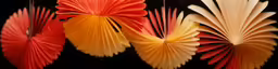 three paper fans, one with a flower on each
