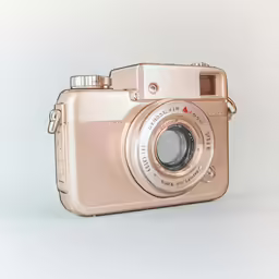 a digital camera sits empty on the table