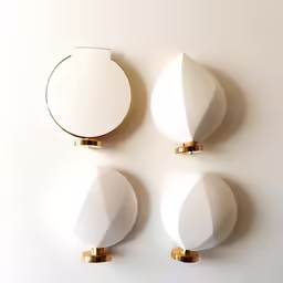the three white objects are all hanging on the wall