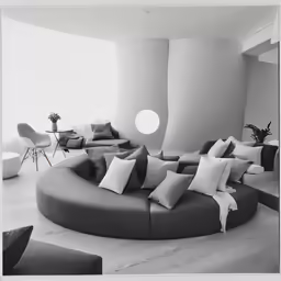 the inside of a large living room filled with furniture