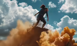 the young girl rides up a rocky hill on her skateboard