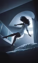 woman in white dress standing on bed with window behind her