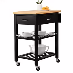 a small kitchen island on wheels that has two white plates and silverware on it