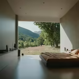 a bedroom with open doors leading to the outside