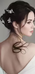 a beautiful woman with her hair in a bun and flowers