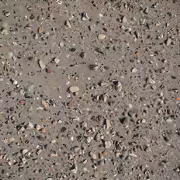 a photo of various rocks and sand under a bridge