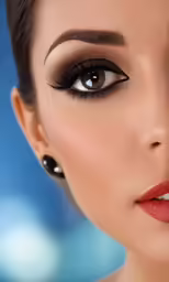 a woman with brown eyes wearing eyeliner and makeup