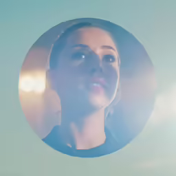 a woman with blue eyes looking up in the air