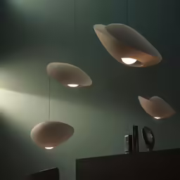 hanging lights are hung in the air on the wall