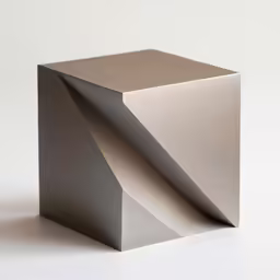 a silver cube is placed on top of the floor