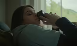 a young woman is taking her picture with her camera