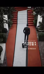 a man in a suit walking down the aisle