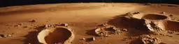 a view of the surface of mars, including two large stones and a dark background