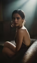 the young woman is posing in the spotlight of a spot light